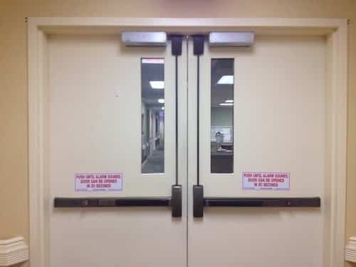 Commercial door with exit device
