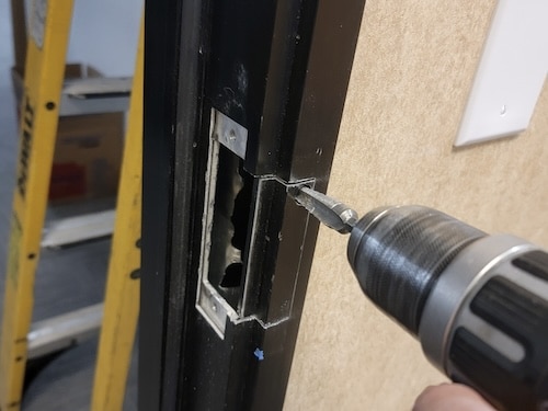 Drilling metal door frame for electric strike