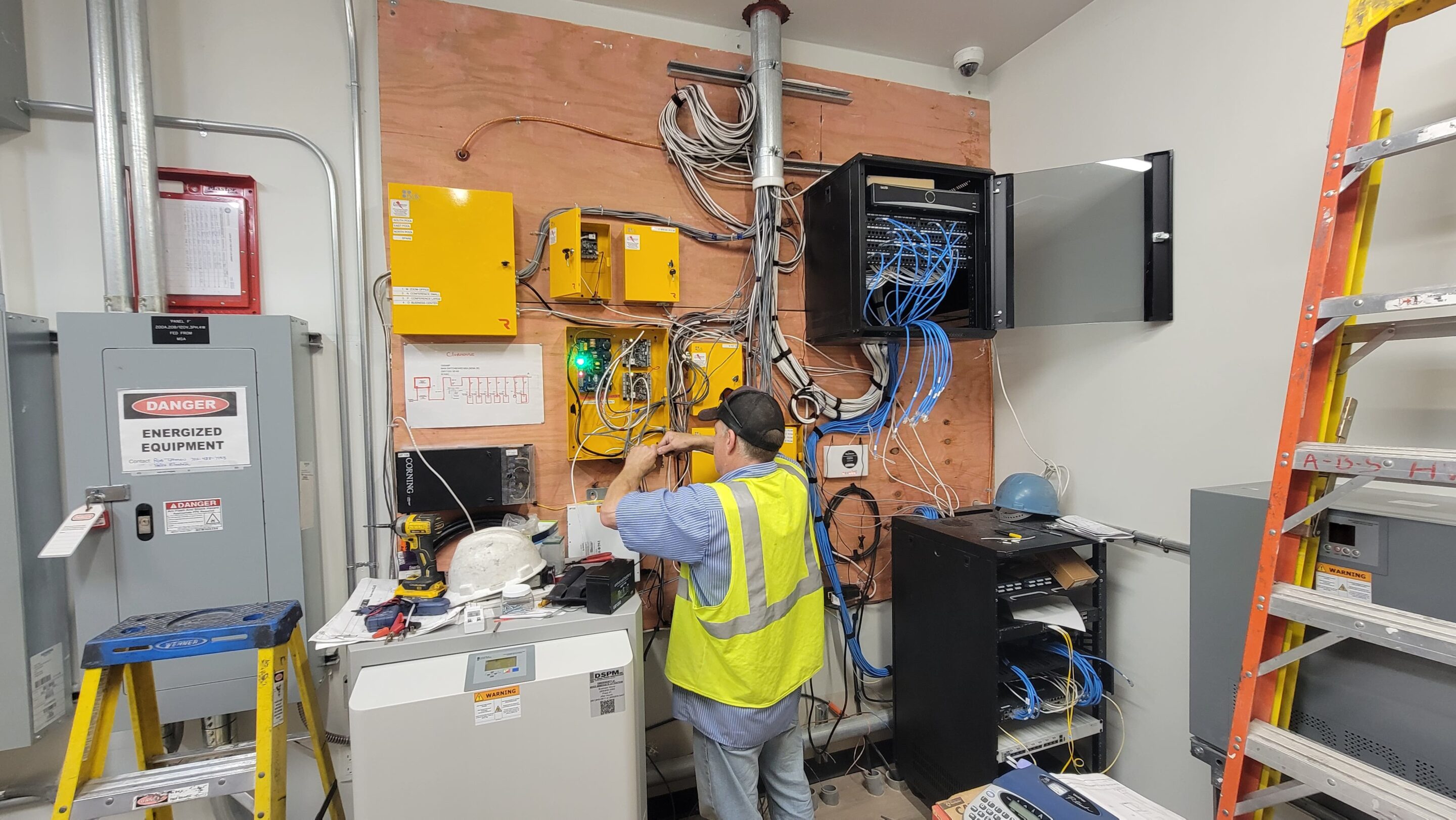 Lock master technician wiring and preparing PDK integrated access system.